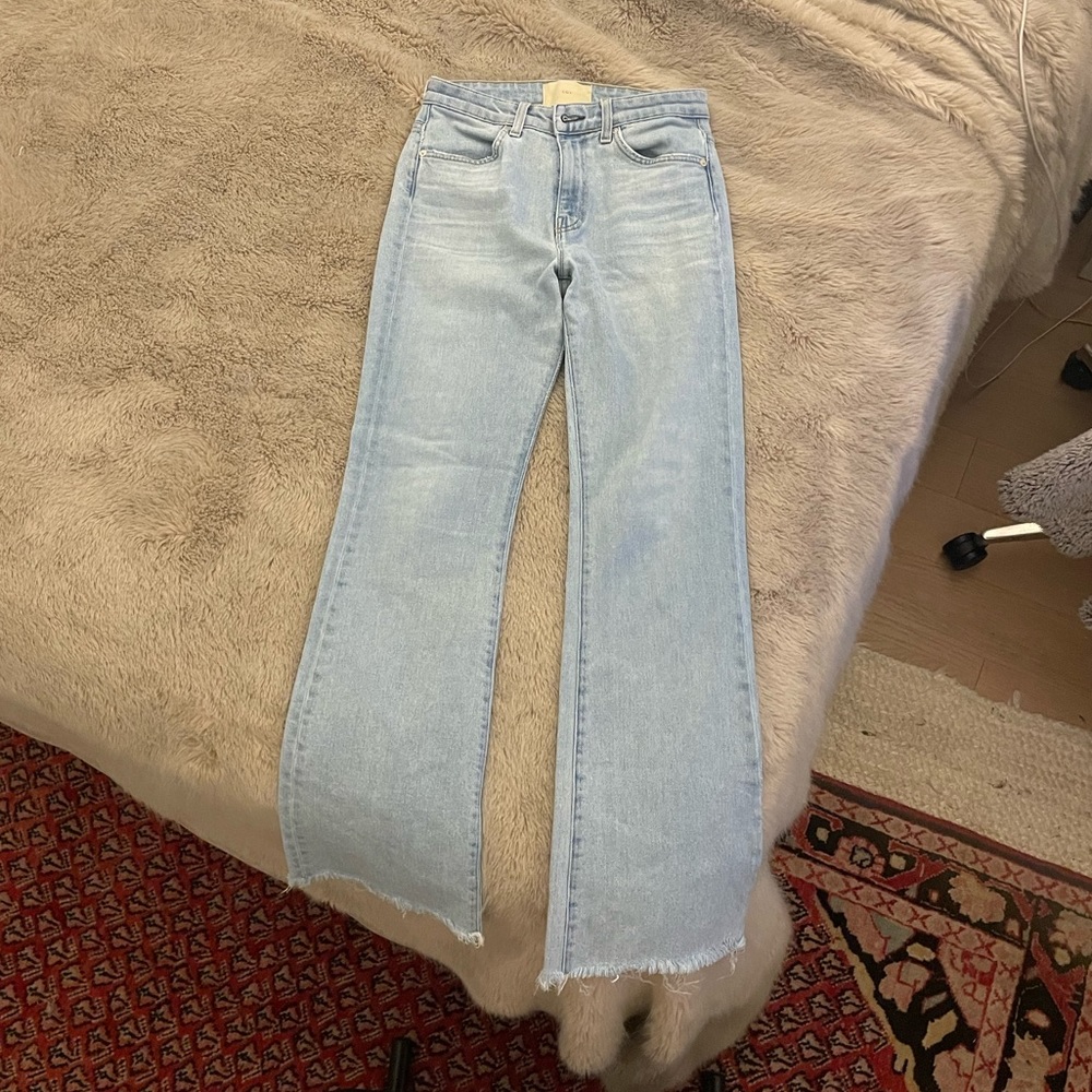 CQY light wash high rise boot cut jeans.